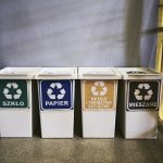 Cztery kosze na odpady sortowane - szkło, papier, metale i mieszane
